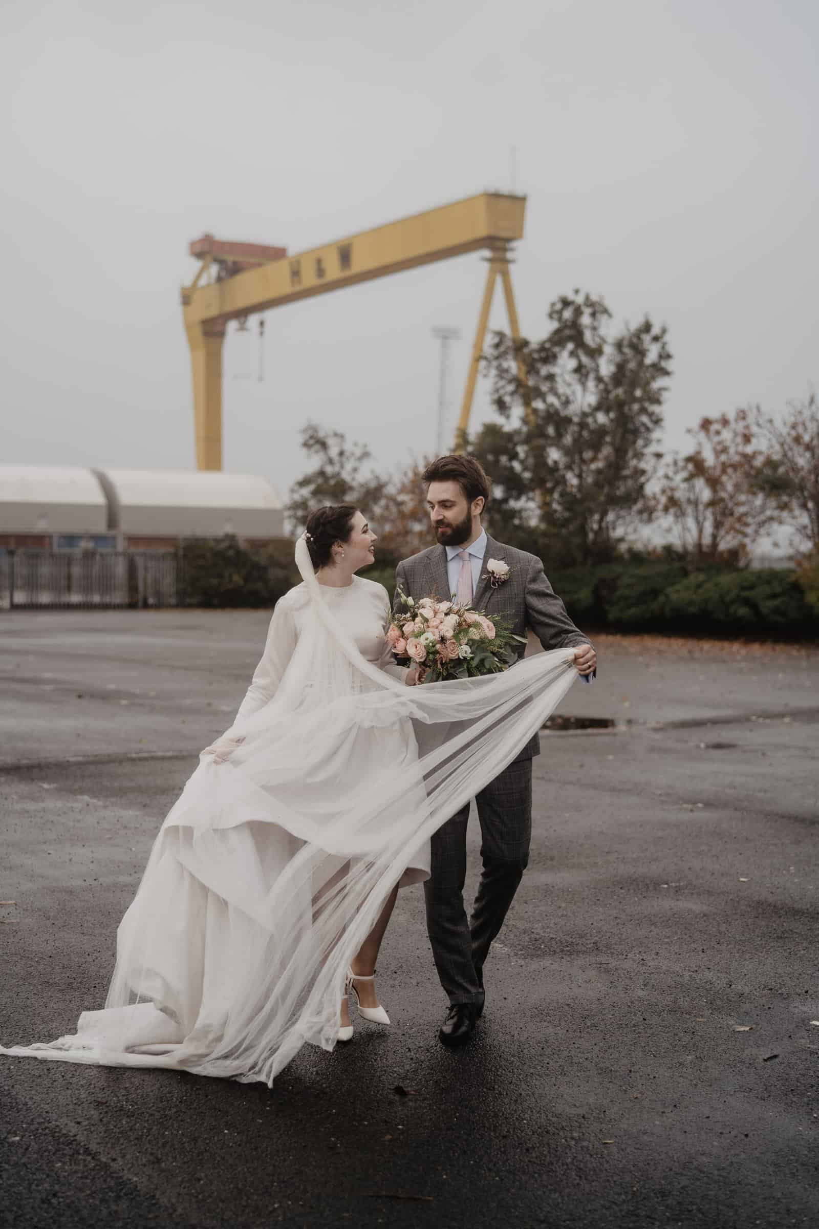 Bride and Groom outside Harland and wolf Cranes Belfast
