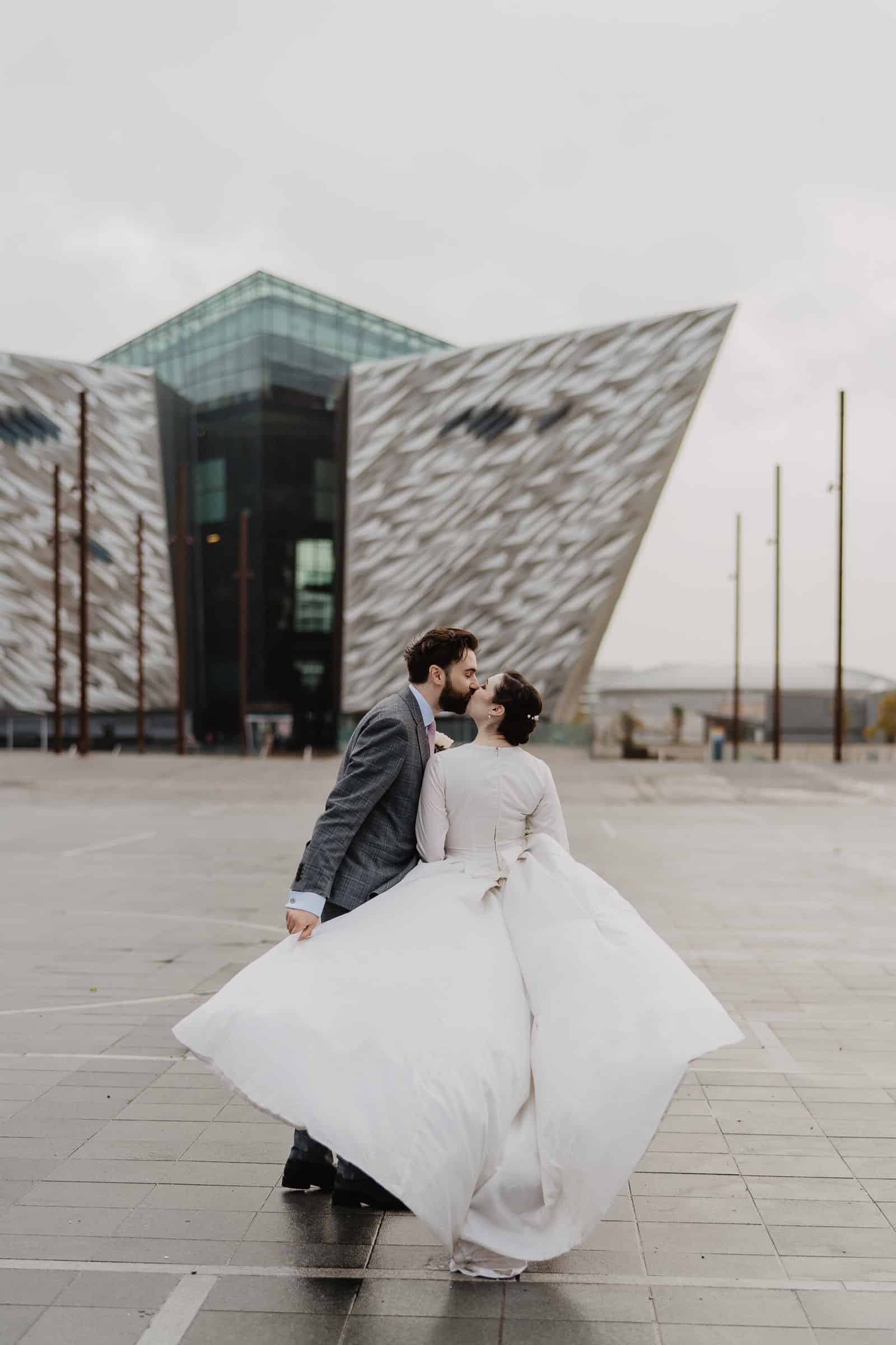 Bride and groom outside Titanic Quarter Belfast